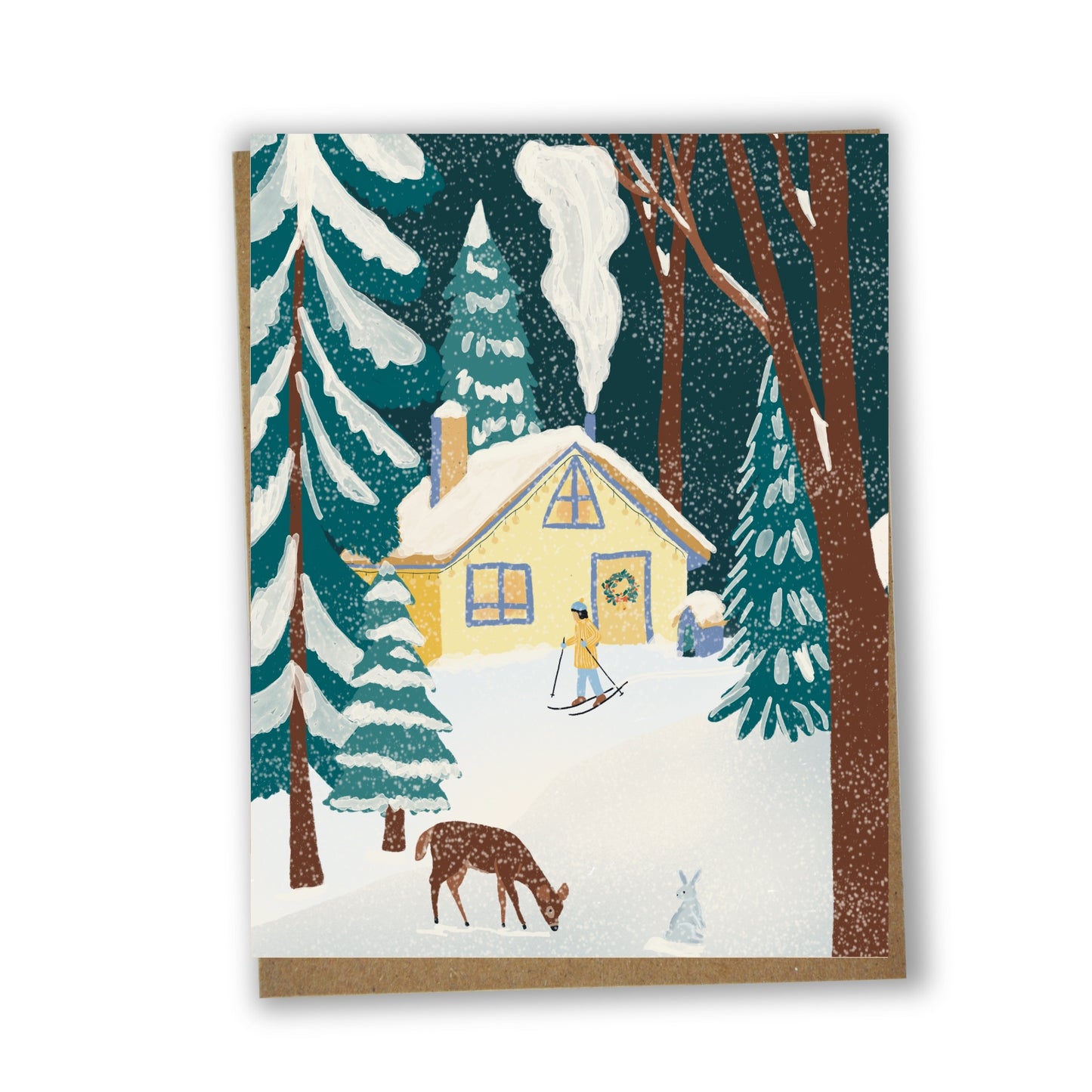 Carte de souhaits illustrée d’un chalet enneigé dans une forêt québécoise